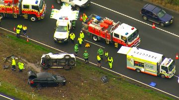 A father and son have been killed in a &quot;very traumatic&quot; highway crash this morning on the NSW Central Coast.
