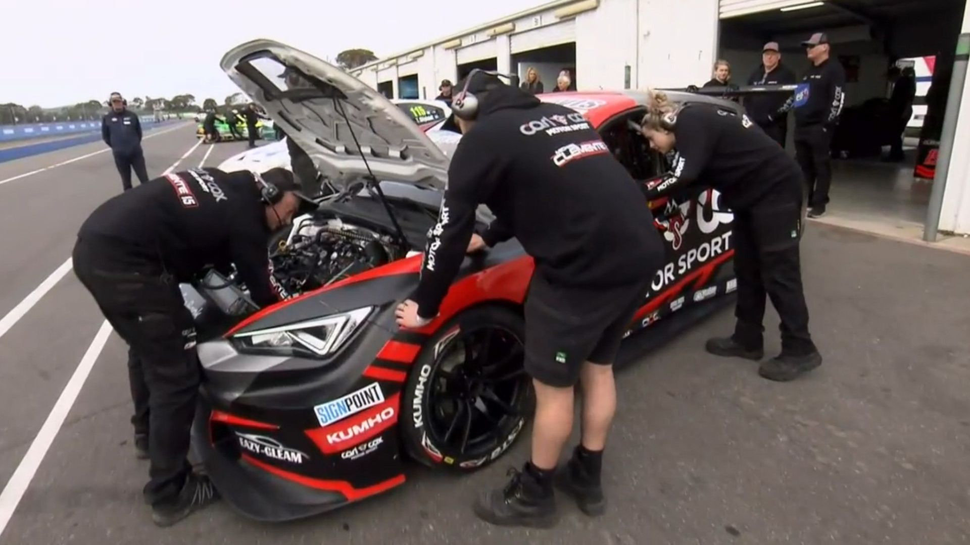 The Carl Cox Motorsport team work to diagnose the issue with Michael Clemente&#x27;s car.