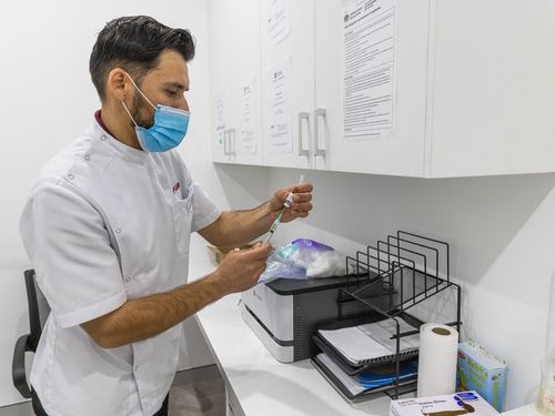 A pharmacist preparing a Covid-19 vaccine.