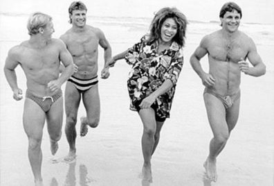 The iconic shot of Tina Turner running on the beach with rugby league superstars Allan Langer (left), Andrew Ettinghausen and Wayne Pearce.