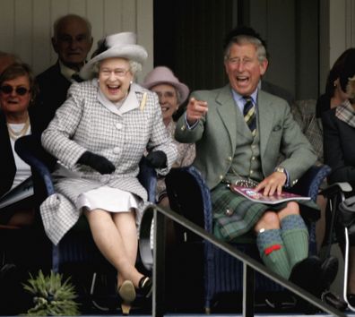Her Majesty and King Charles watch competitors during the Braemar Gathering in Scotland in 2006.