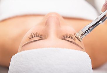 What type of material was used in the first microdermabrasion units?