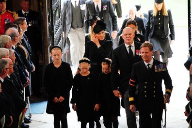 Mike and Zara Tindall and daughter Lena Tindall, with Isla Phillips, second left, and and Savannah Phillips, left, arrive for the committal service for Queen Elizabeth II at  St. George's Chapel at Windsor Castle, Windsor, England, Monday Sept. 19, 2022