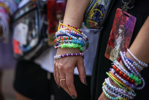 Taylor Swift fans also known as "Swifties" wear bracelets on their wrists as they arrive before she performs as part of her "Taylor Swift | The Eras Tour" at Melbourne Cricket Ground on February 16, 2024 in Melbourne 