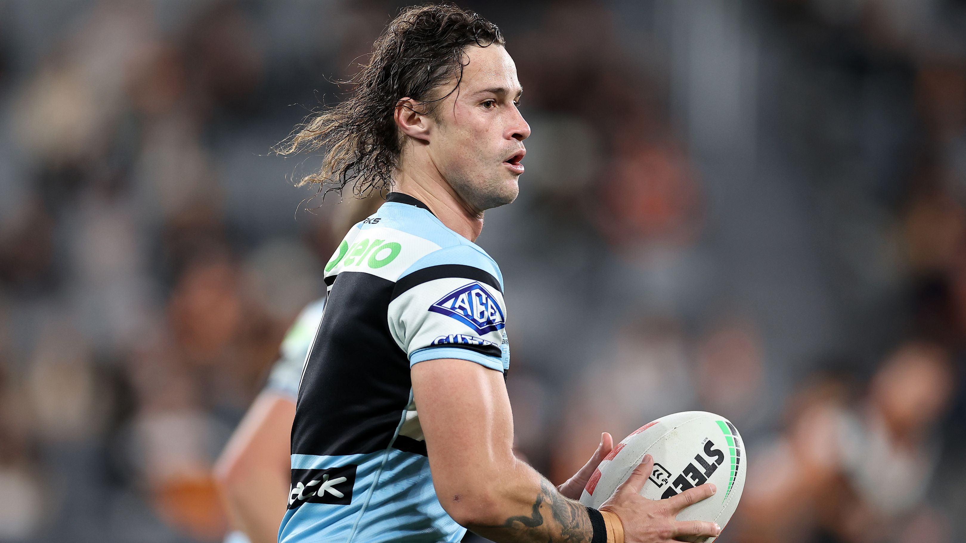 SYDNEY, AUSTRALIA - JULY 06:  Nicholas Hynes of the Sharks runs the ball during the round 19 NRL match between Wests Tigers and Cronulla Sharks at CommBank Stadium on July 06, 2023 in Sydney, Australia. (Photo by Cameron Spencer/Getty Images)