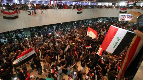 Hundreds of protesters storm Iraq's Green Zone and invade parliament