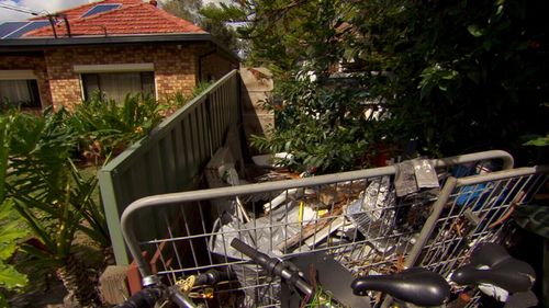 Robert's next-door home is filled with rubbish.