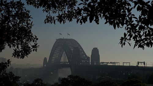 The Sydney Harbour Bridge seen through smoke haze today.