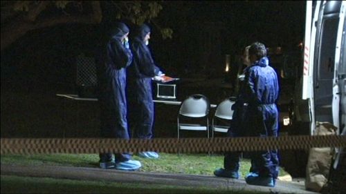 Forensic police at the home in Bateman. (9NEWS)