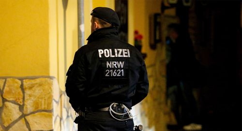 A Police officer stands outside Italian restaurant in mob raids.