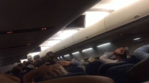 Frightened passengers were told to put their hands over their heads and evacuate plane. (Twitter)