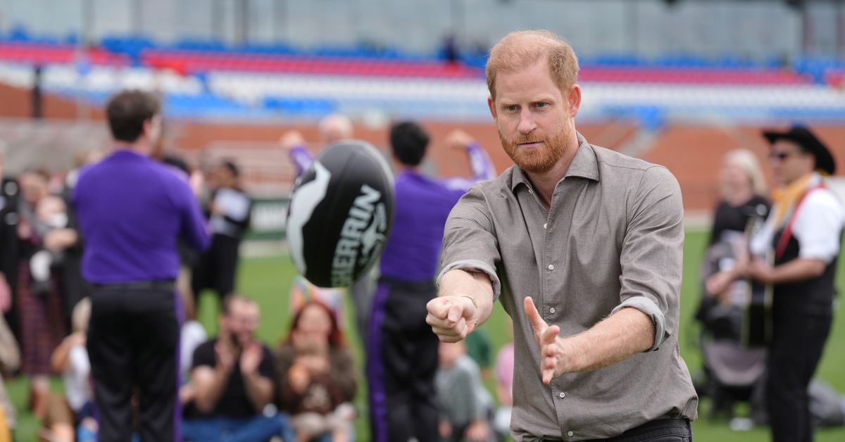 Prince Harry hones his AFL skills on second day of Australian tour