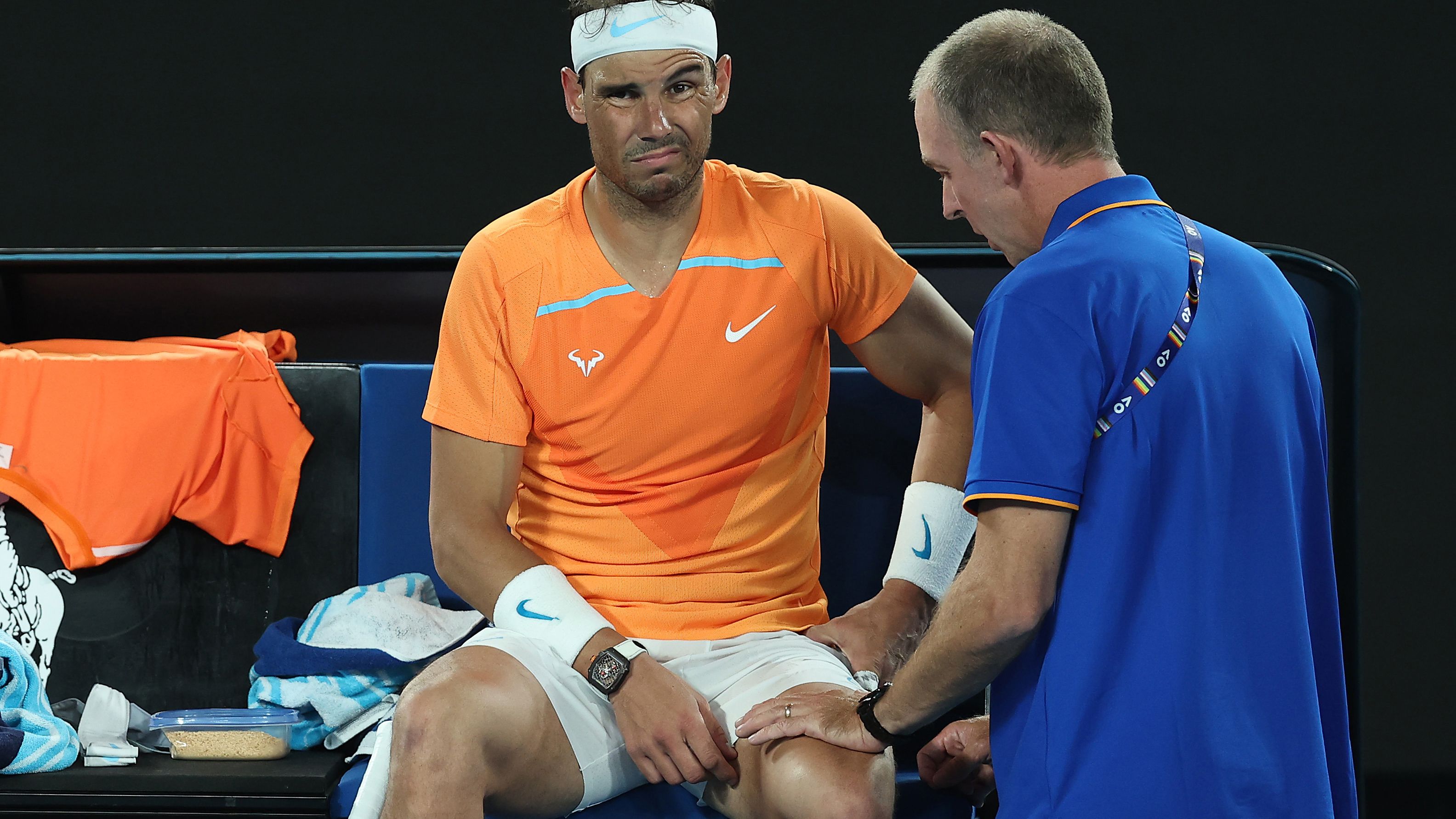 Rafael Nadal of Spain receives attention during a medical time out against Mackenzie McDonald of the United States. (Photo by Cameron Spencer/Getty Images)