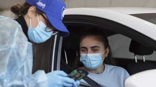 A patient arrives to receive a COVID-19 vaccine at a new drive-through vaccination clinic  in Sydney.