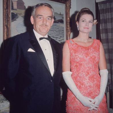 Grace Kelly and Prince Rainier attend a ball, 1965