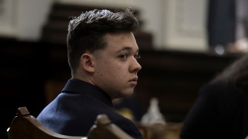 Kyle Rittenhouse listens as his lawyer gives opening statements to the jury at the Kenosha County Courthouse in Kenosha.