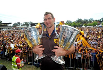 Like a proud dad Luke Hodge has his arms full with the spoils of victory.