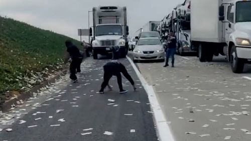 People started grabbing money off the road. 