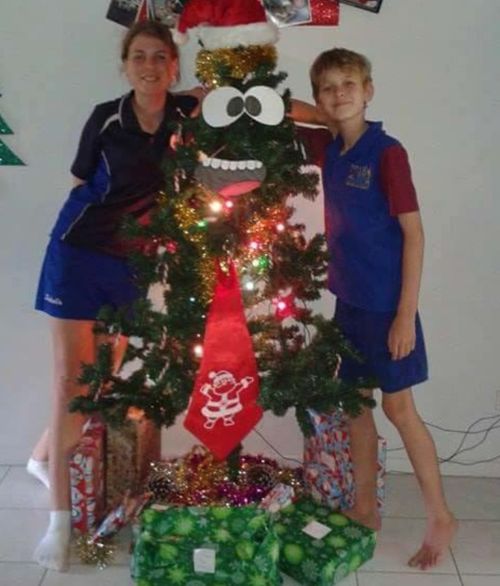 Annabelle and Andrew with a re-erected tree. (Supplied)