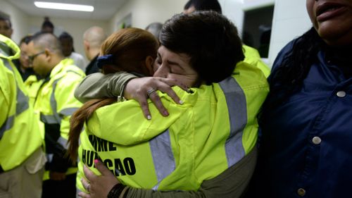 Rescue team members Candida Lozada, left, and Stephanie Rivera, right, embrace as they wait to assist in the aftermath of Hurricane Maria in Humacao, Puerto Rico. (AP)