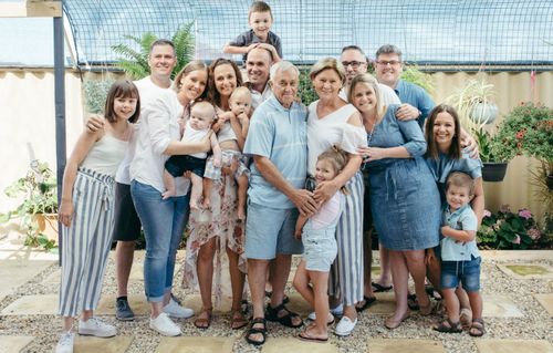 Mr and Mrs Vella, pictured with their whole family in Australia.