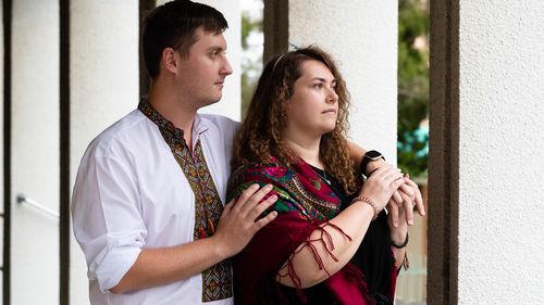 Olexa Matiouk, with his girlfriend, Anna Martyniak, at the St Andrews Ukrainian Church in Lidcombe, Sydney. He is a first generation australian but he has extended family in the Ukraine. His uncle, who is a former soldier, is now a security guard on a military installation, near Dnipro, preparing to protect the site against the Russian invasion. 