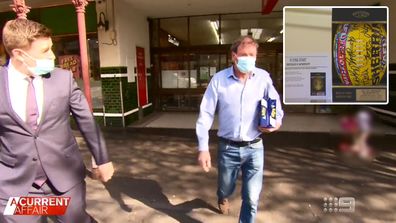 Ricky Nixon confronted over alleged dud footy signatures.
