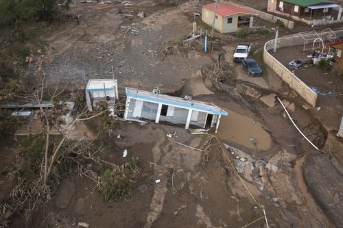 A house lies in mud after being washed away by Hurricane Fiona at Villa Esperanza in Salinas, Puerto Rico, Wednesday, September 21, 2022.  (AP Photo/Alejandro Granadillo)