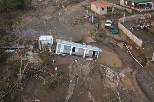 A house lays in the mud after it was washed away by Hurricane Fiona at Villa Esperanza in Salinas, Puerto Rico, Wednesday, Sept. 21, 2022. (AP Photo/Alejandro Granadillo)