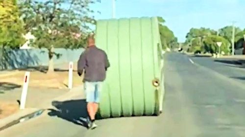 The video shows them yelling "Charge!" as they tear down the house, as well as rolling the water tank down the street.
