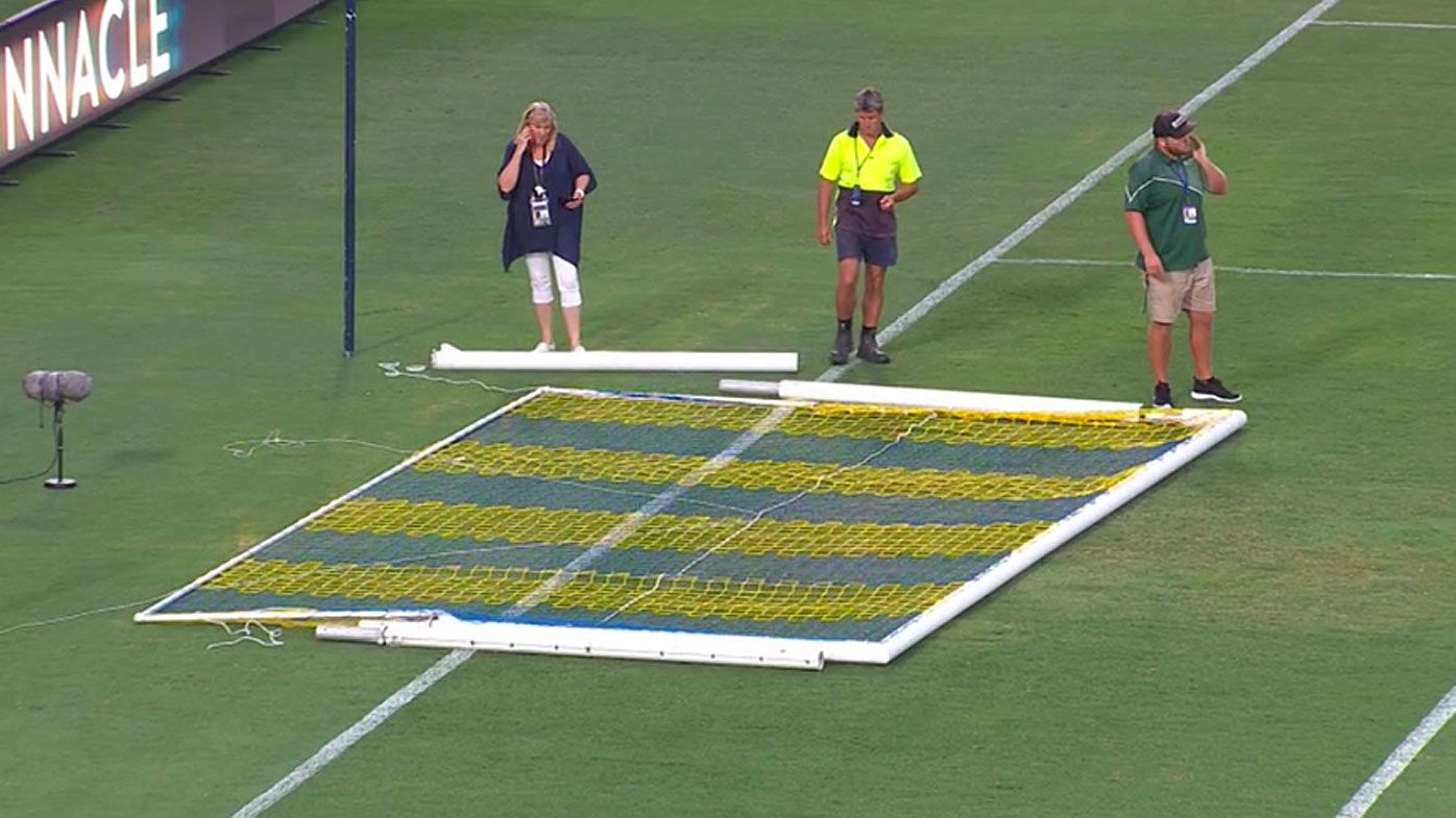 Mariners staff inspect the broken goal posts