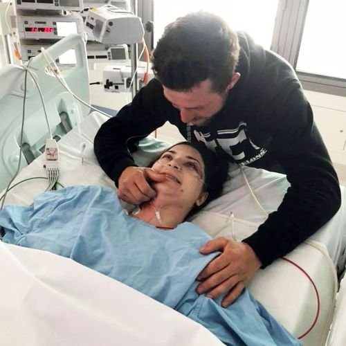Ms Vithoulkas with her fiance James Wild in hospital.