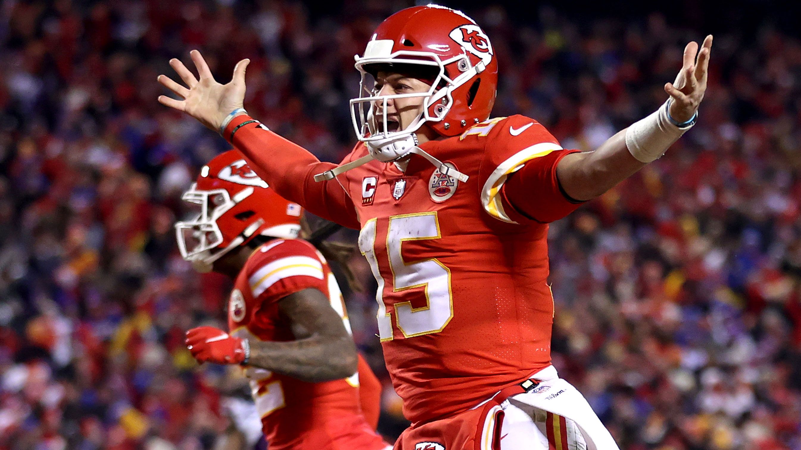 Patrick Mahomes #15 of the Kansas City Chiefs celebrates a touchdown scored by Tyreek Hill #10 against the Buffalo Bills.