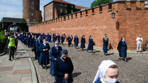 Nuns practice social distancing during an outdoor mass in Krakow, Poland.