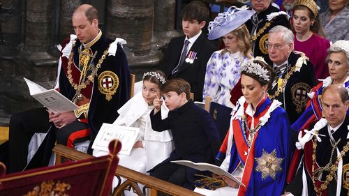 From left, 1st row, Britain's Prince William, Princess Charlotte, Prince Louis, Kate, Princess of Wales and the Prince Edward Duke of Edinburgh at the coronation ceremony of King Charles III in Westminster Abbey, London, Saturday May 6, 2023. (Yui Mok, Pool via AP)