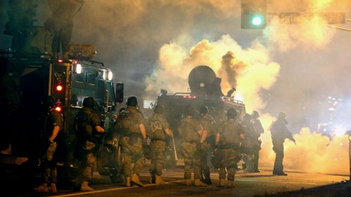 Police attempt to control demonstrators protesting the killing of teenager Michael Brown. (Getty Images)