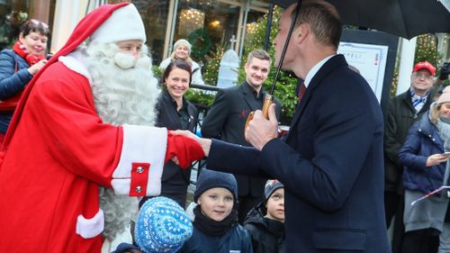 Prince William meets Santa while on a visit to Finland. (AAP)