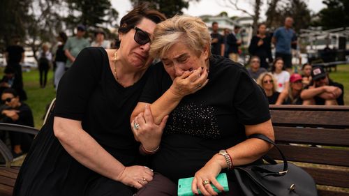 Mother and daughter, Jana and Ella embrace while gathering at Bondi Pavilion, two days after a mass shooting at Bondi Beach, on December 16, 2025 in Sydney, Australia. 