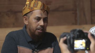 Indonesian militant Umar Patek answers questions from reporters during his visit at the house of his long-time friend Ali Fauzi, a former militant who now runs a de-radicalisation program, in Lamongan, East Java, Indonesia, Tuesday, Dec. 13, 2022.  