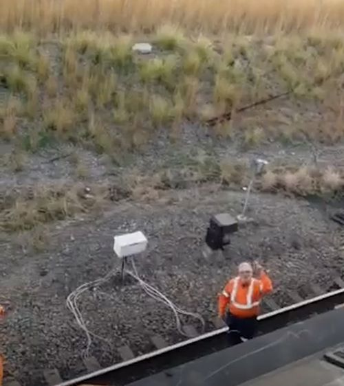 The driver unleashed on Weekes at Sandgate in Newcastle, north of Sydney, after the protester stopped the train from moving by being on top of it.