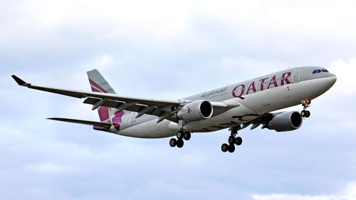 A Qatar Airways plane takes off.