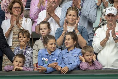 LONDON, ENGLAND - July 14:  Mirka Federer, wife of Roger Federer with their children nine-year-old twin girls Charlene and Myla and five-year-old boys Lenny and Leo during presentations after Roger Federer of Switzerland loss against Novak Djokovic of Serbia during the Men's Singles Final on Centre Court during the Wimbledon Lawn Tennis Championships at the All England Lawn Tennis and Croquet Club at Wimbledon on July 14, 2019 in London, England. (Photo by Tim Clayton/Corbis via Getty Images)