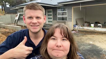 Josh Girle-Bennett and his wife Michelle, pictured outside their almost completed first home in Orange, NSW.