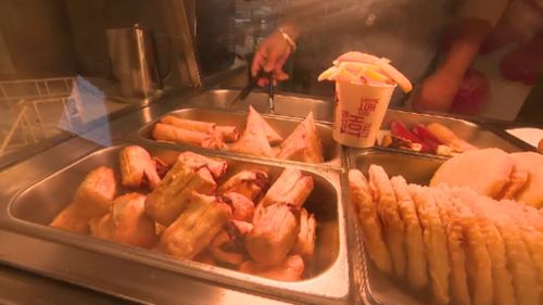 The sight of golden fried spring rolls and potato cakes is soon to be a distant memory for passengers. (9NEWS)