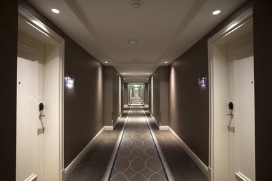 Long corridor. Indoor architectural feature. hotel corridor