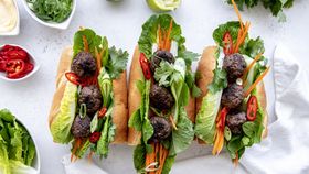 Charred veal meatballs served in a banh mi recipe