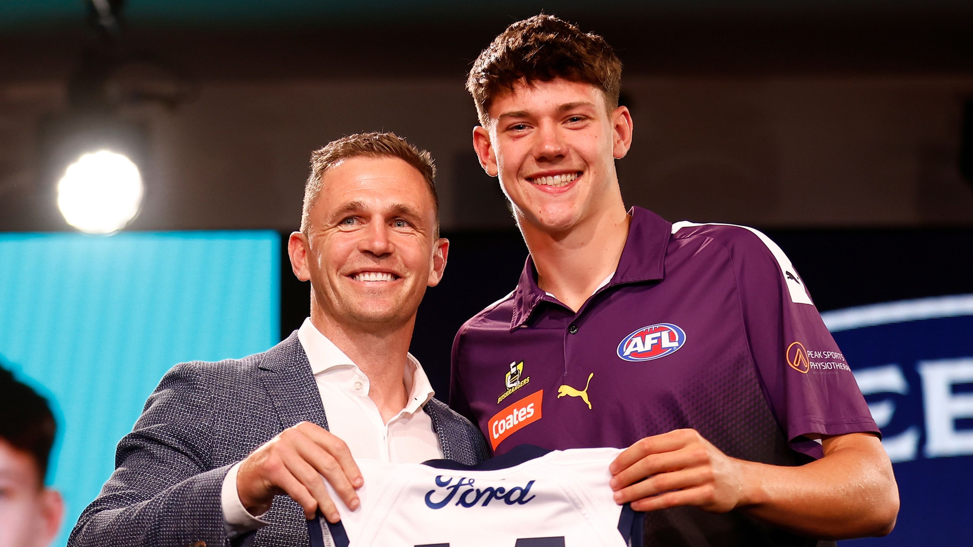 MELBOURNE, AUSTRALIA - NOVEMBER 20: Connor O&#x27;Sullivan is seen with Joel Selwood after being selected at number 11 by the Geelong Cats during the 2023 AFL Draft at Marvel Stadium on November 20, 2023 in Melbourne, Australia. (Photo by Michael Willson/AFL Photos via Getty Images)