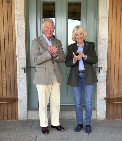 Prince Charles and the Duchess of Cornwall, joining in 'Clapping for our Carers' outside the front door of their home at Birkhall in Balmoral, Scotland