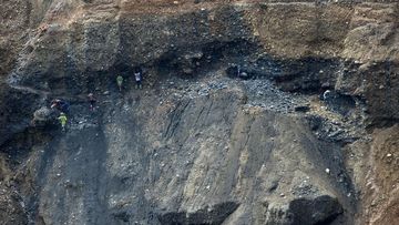 Miners digging for raw jade stones, next to a jade mine in Hpakant, Myanmar’s Kachin State. (AFP)