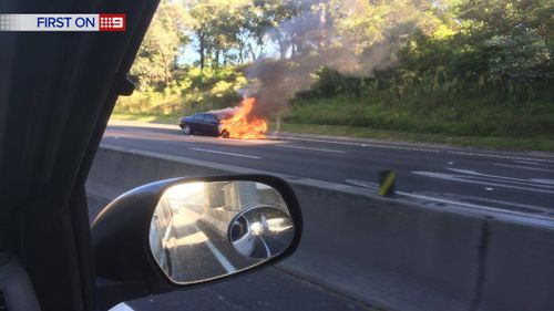 Fiery smash blocks traffic on busy motorway in Sydney's west
